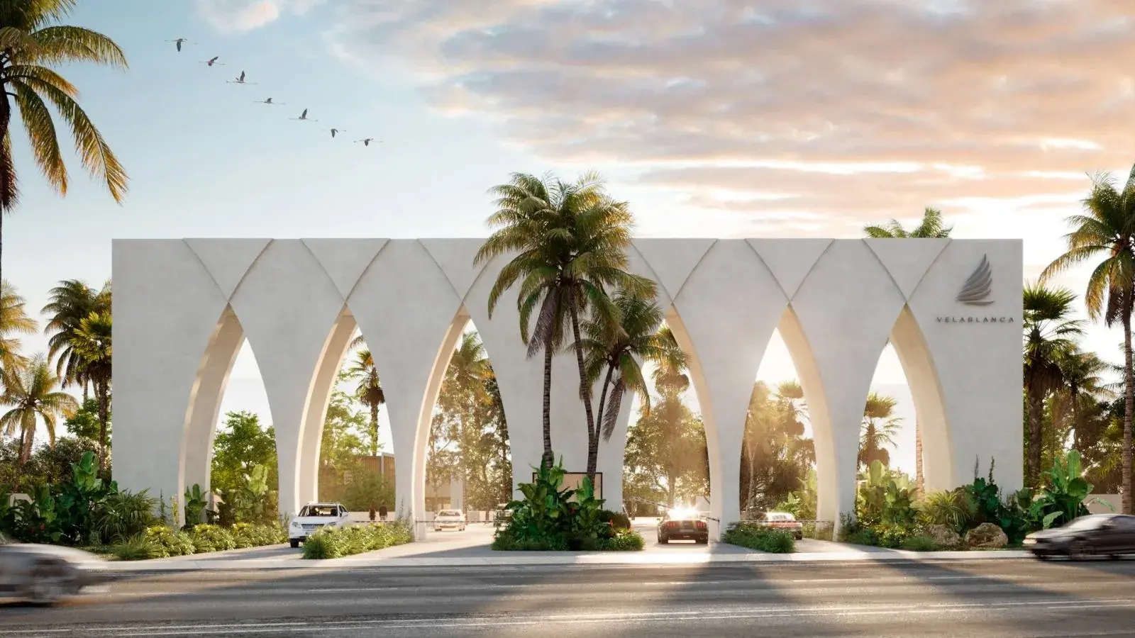Acceso principal de Velablanca: arcos blancos entre palmeras en Chicxulub